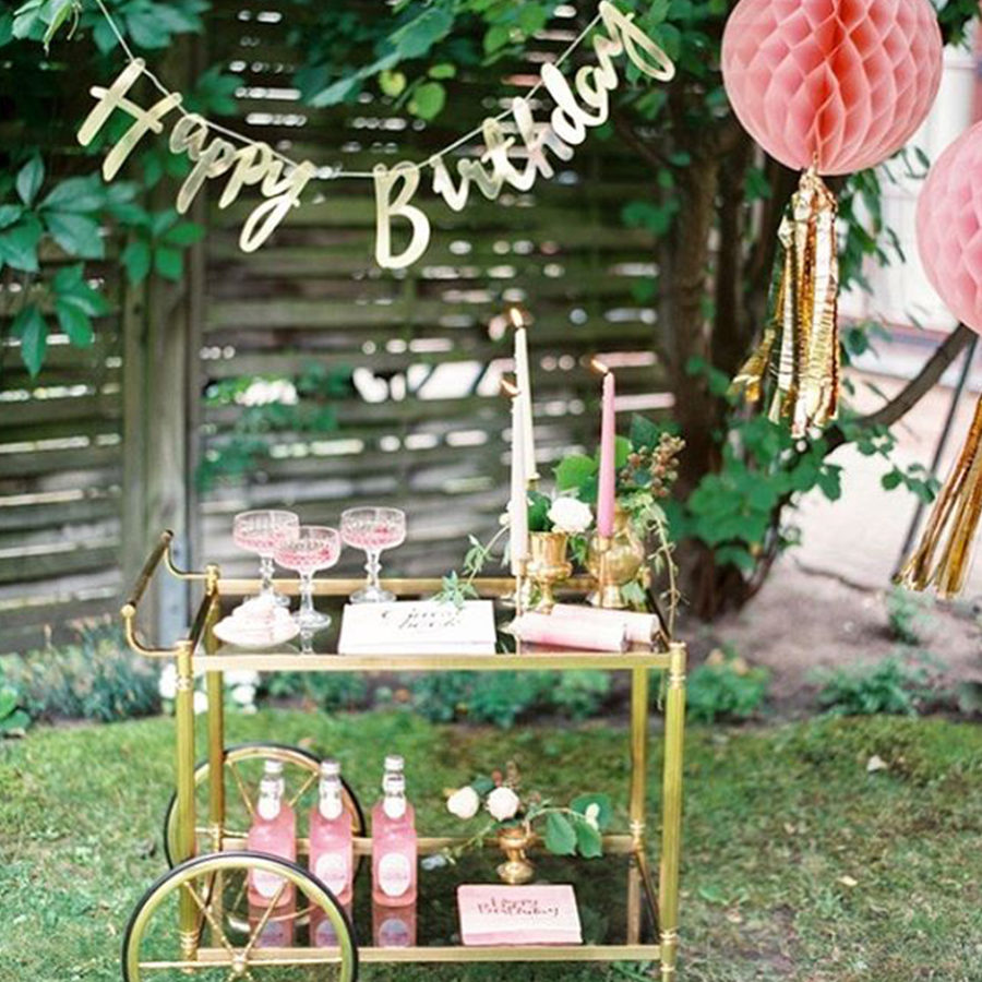 Happy birthday banner and drinks cart